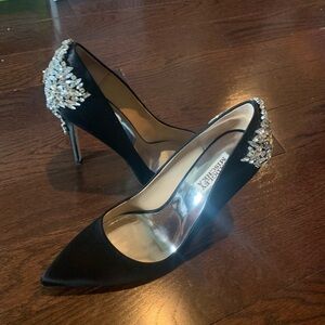 Black satin pumps